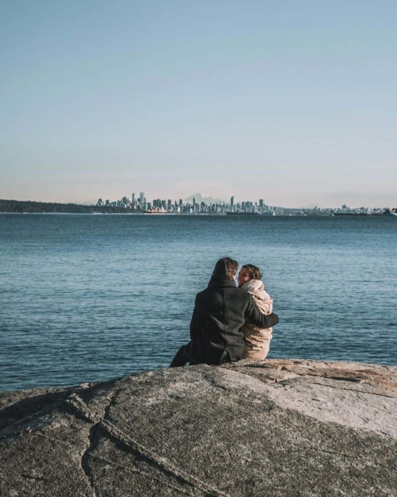 Couple looking at Vancouver from Lighthouse Park