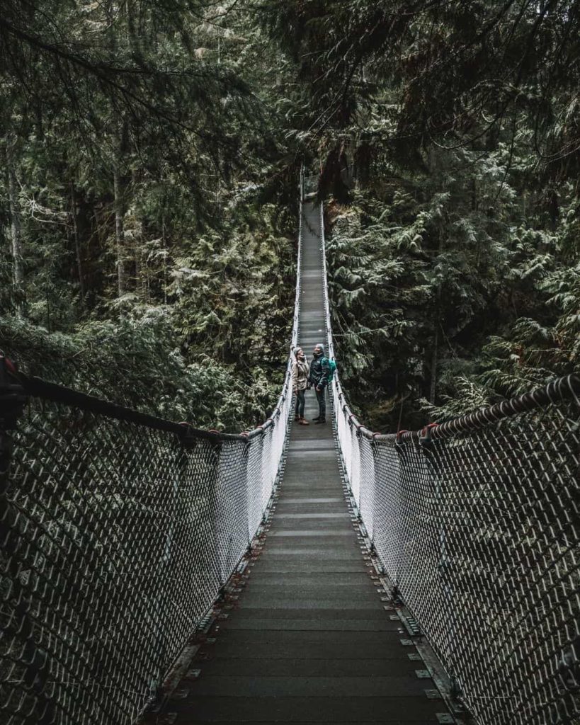 Couple at Lynn Valley Suspension Bridge, one step of your Vancouver itinerary
