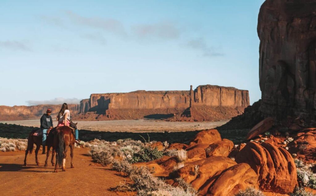 Horseback riding in Monument Valley at sunrise for incredible memories on your USA West Coast tour
