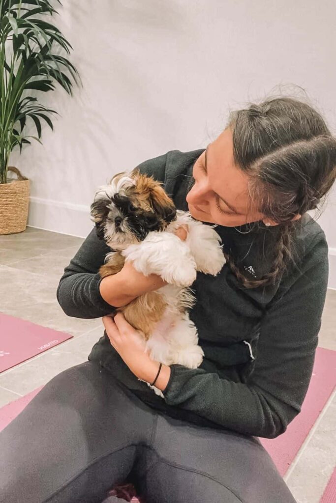 Marie at Puppy Yoga London with a cute Shih Tzu