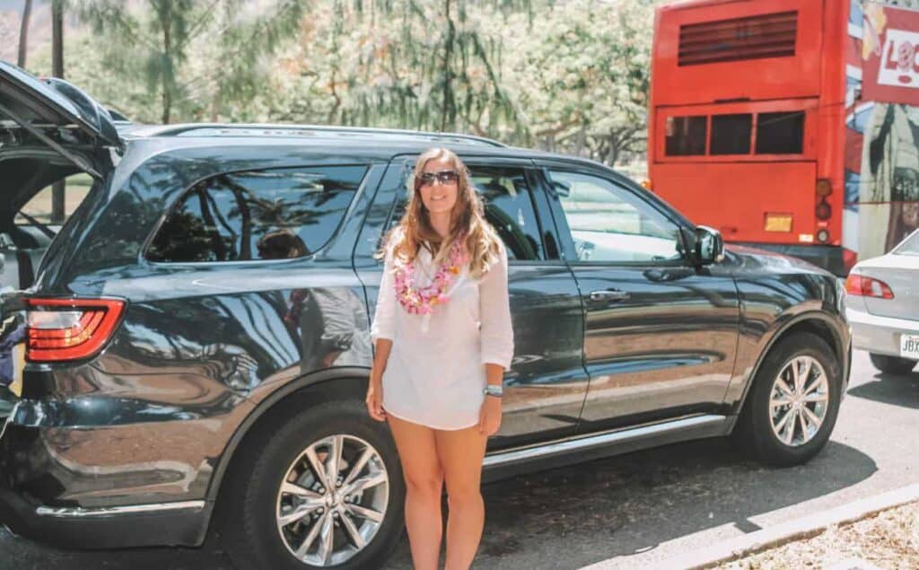 Marie in front of our road trip car in Hawaii