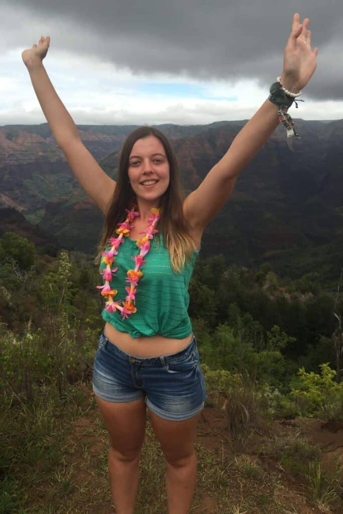 Marie's hiking outfit in Hawaii, wearing shorts and a light tank top