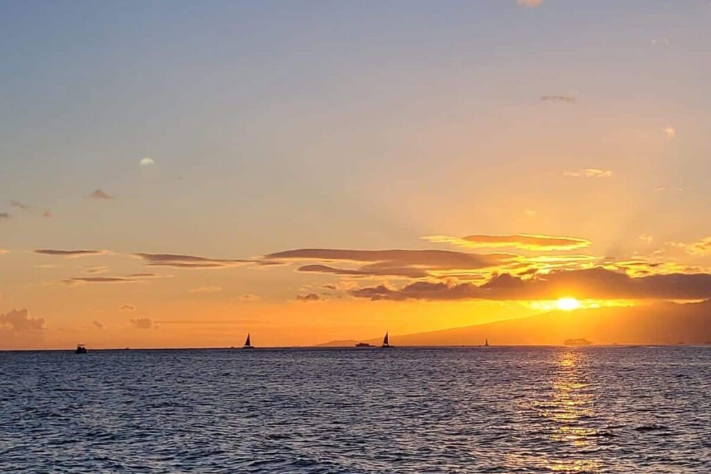Oahu sunset from the catamaran cruise, one of the best sunset cruises in Waikiki