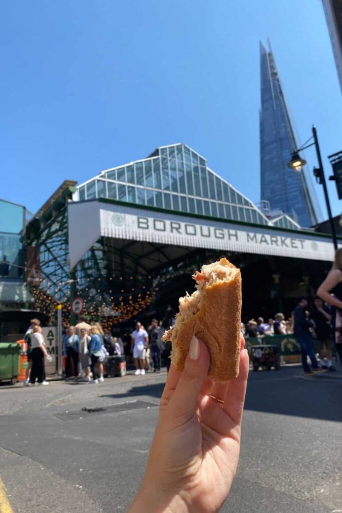 Us having a progressive lunch with fresh baguette and rillette at Borough Market
