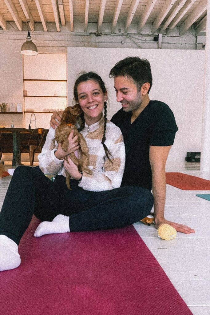 Us with a cockapoo at puppy yoga , one of the cutest London date ideas