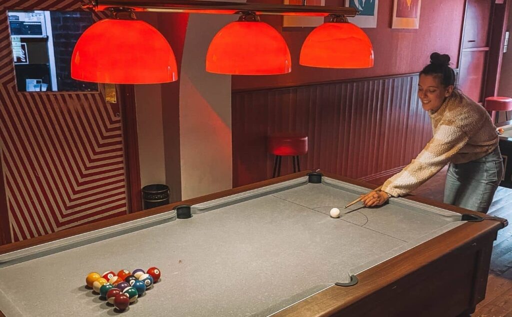 Eric took this photo of me playing Pool at a bar