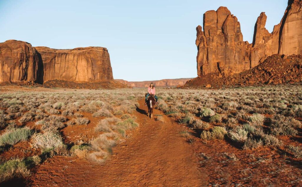 Marie horseback riding in Monument Valley at sunrise