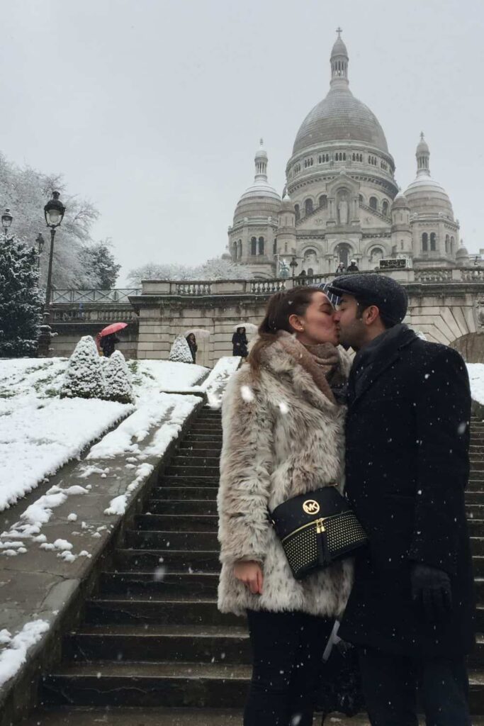Us kissing in front of Montmartre in Paris