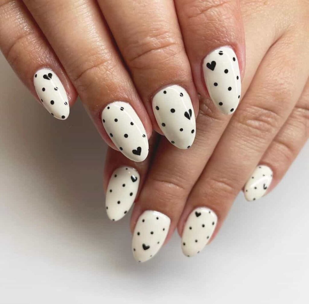 Black and white heart nails by @crow_nail_studio
