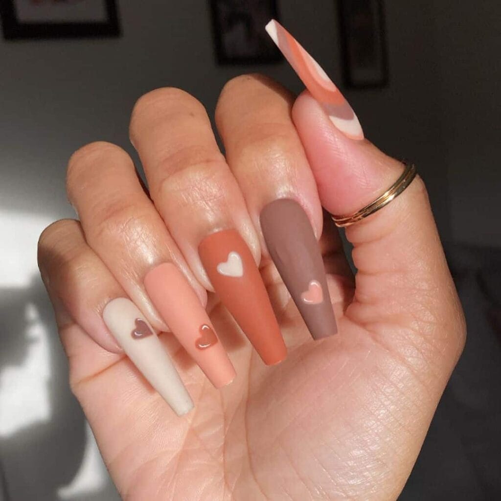 Boho nude heart nails by @studionailscork