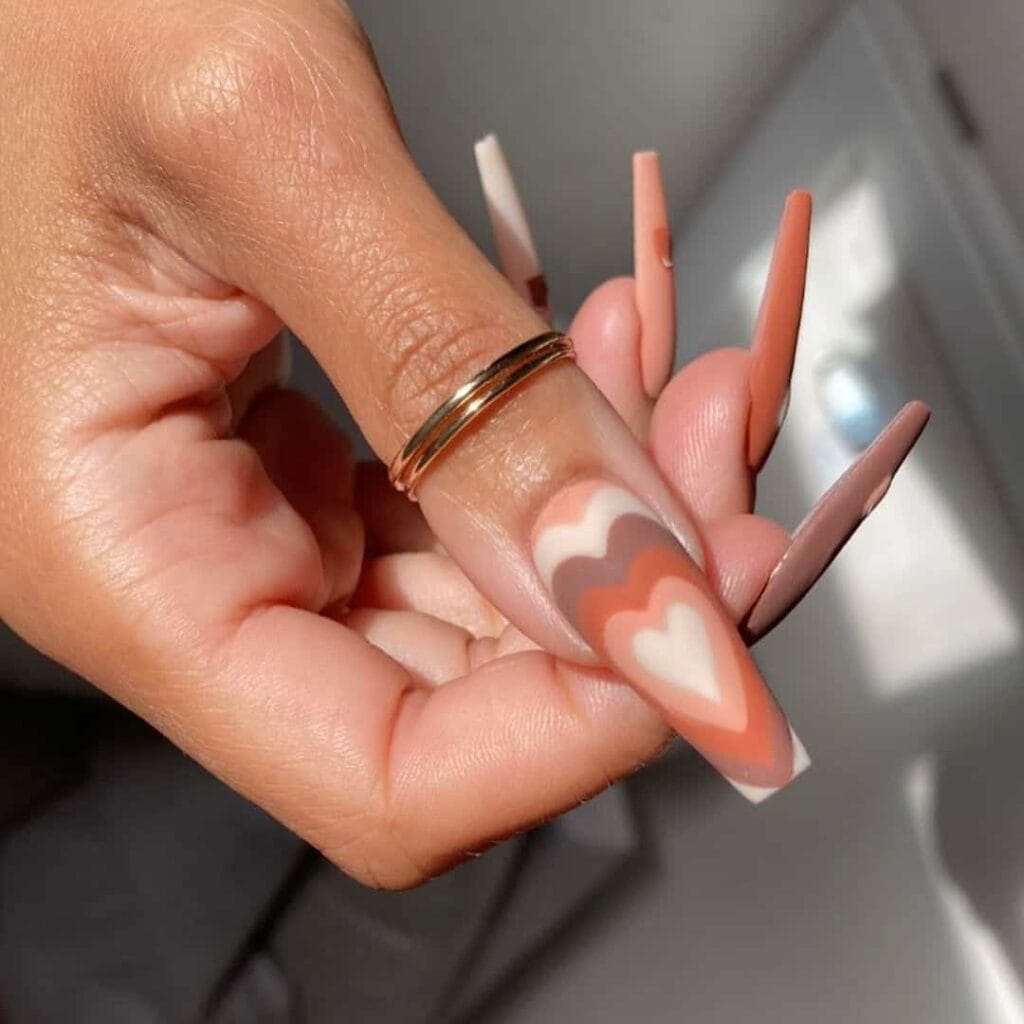 Boho rainbow heart nails by @studionailscork