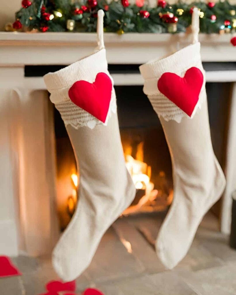 cute romantic stockings hanging on the fireplace