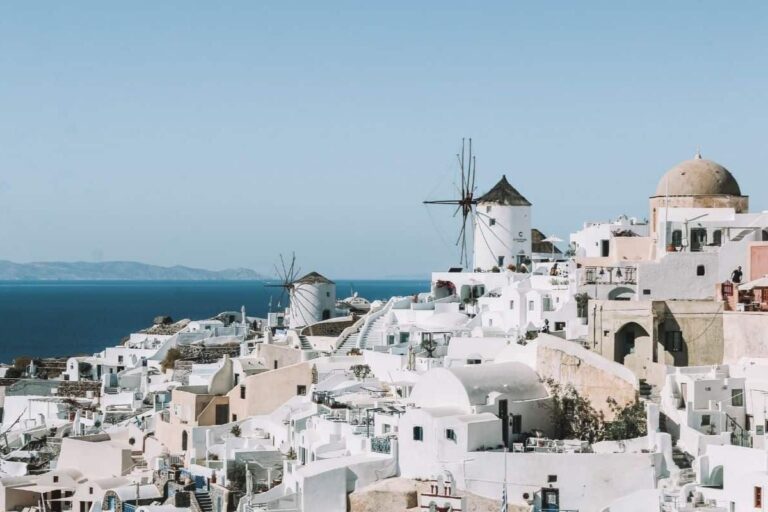 Windmill and white washed houses on the Caldera in Oia