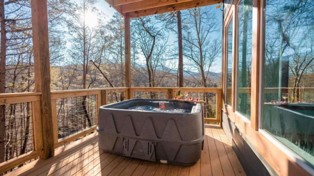 cabin terrace with hot tub and blue sky