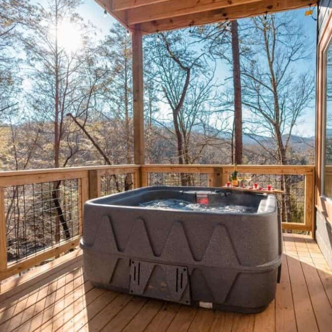 cabin terrace with hot tub and blue sky