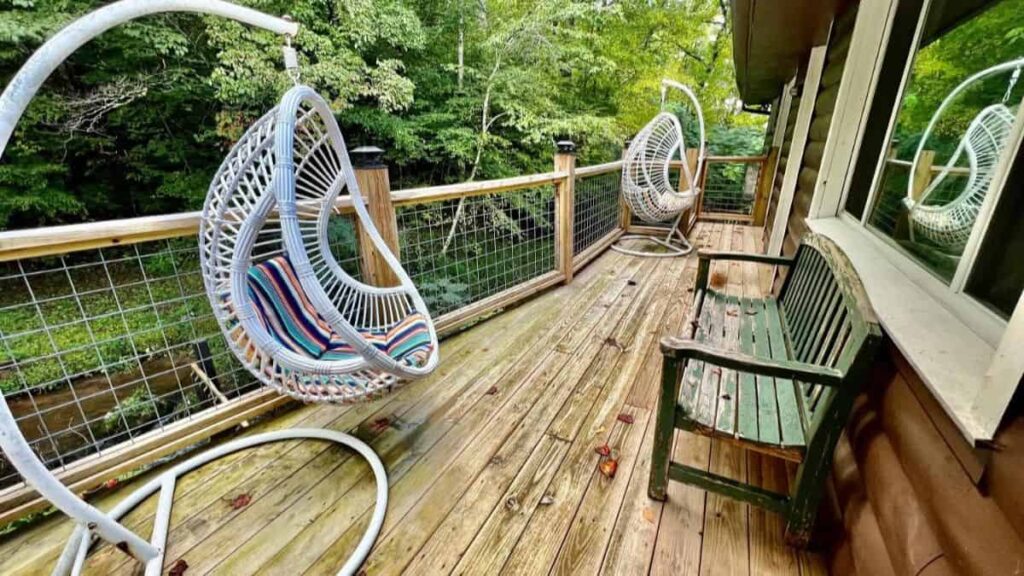 cabin balcony with two egg chairs
