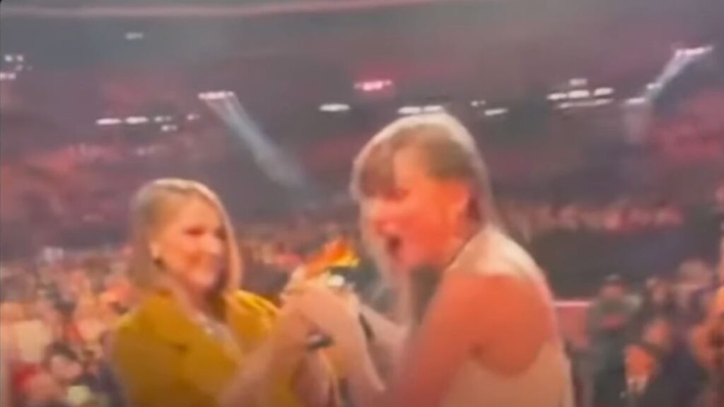 Taylor Swift getting award from Celine Dion at the 2024 Grammys