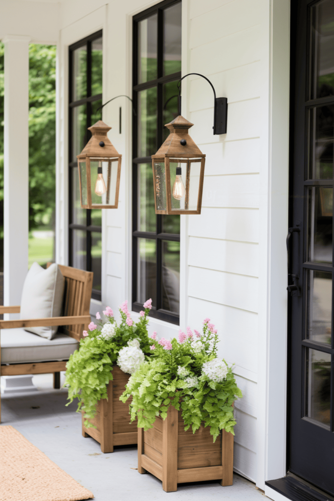 white front porch with swinging chair and green plants and lanterns