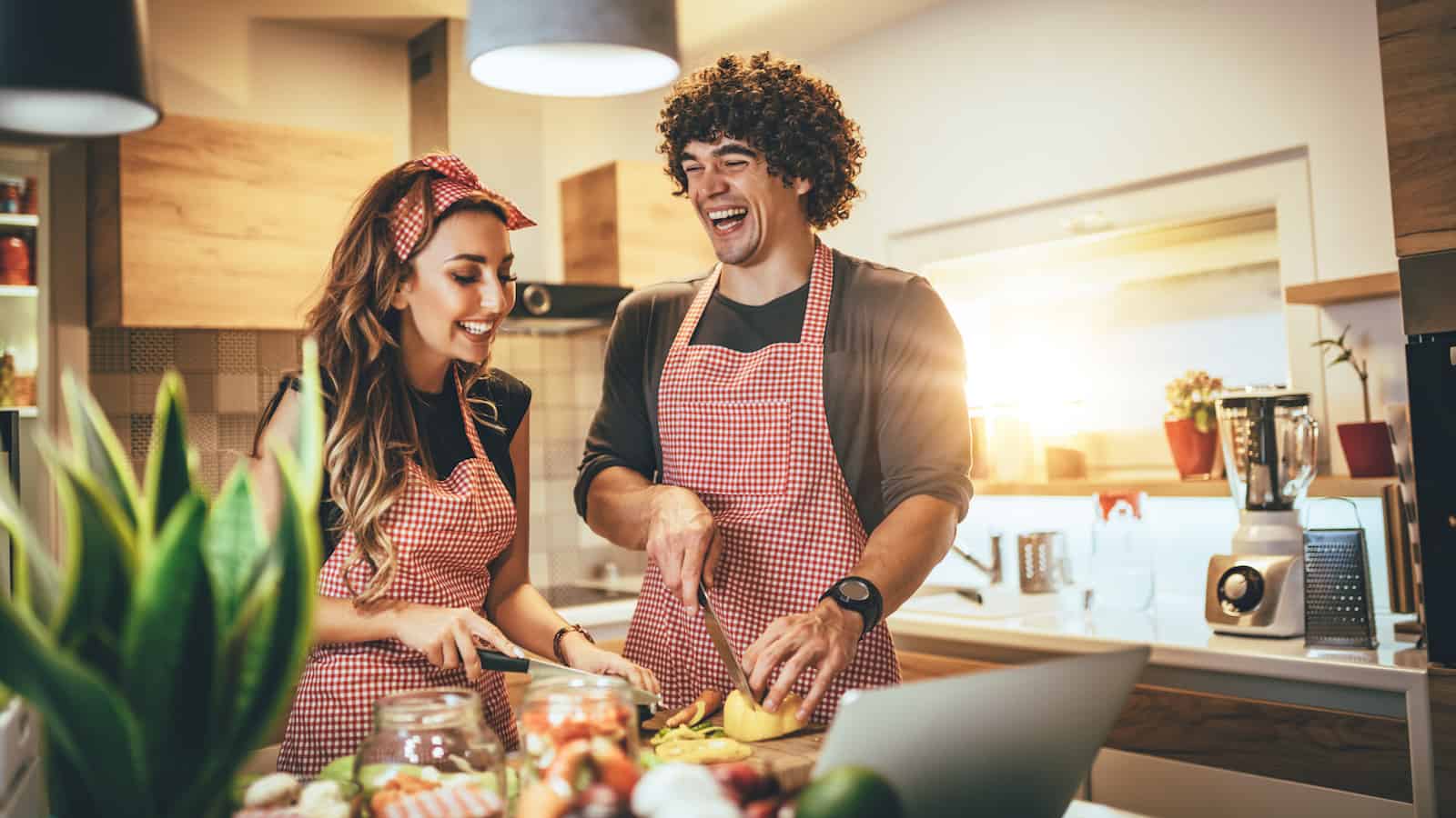 couple cooking together in the kitchen