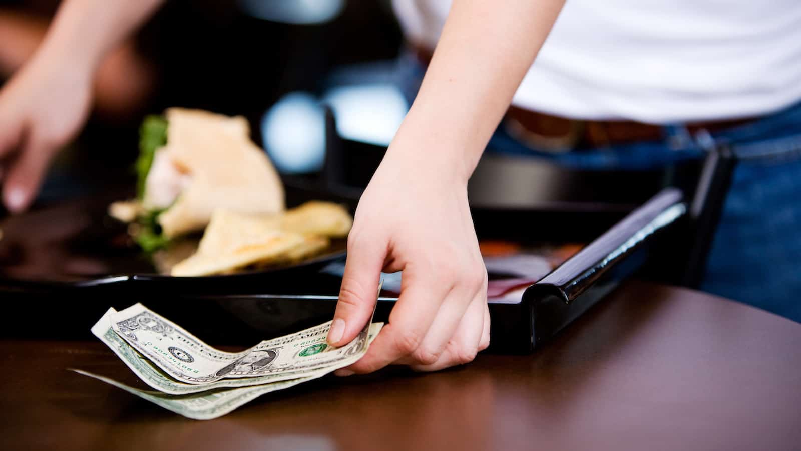 hand taking cash