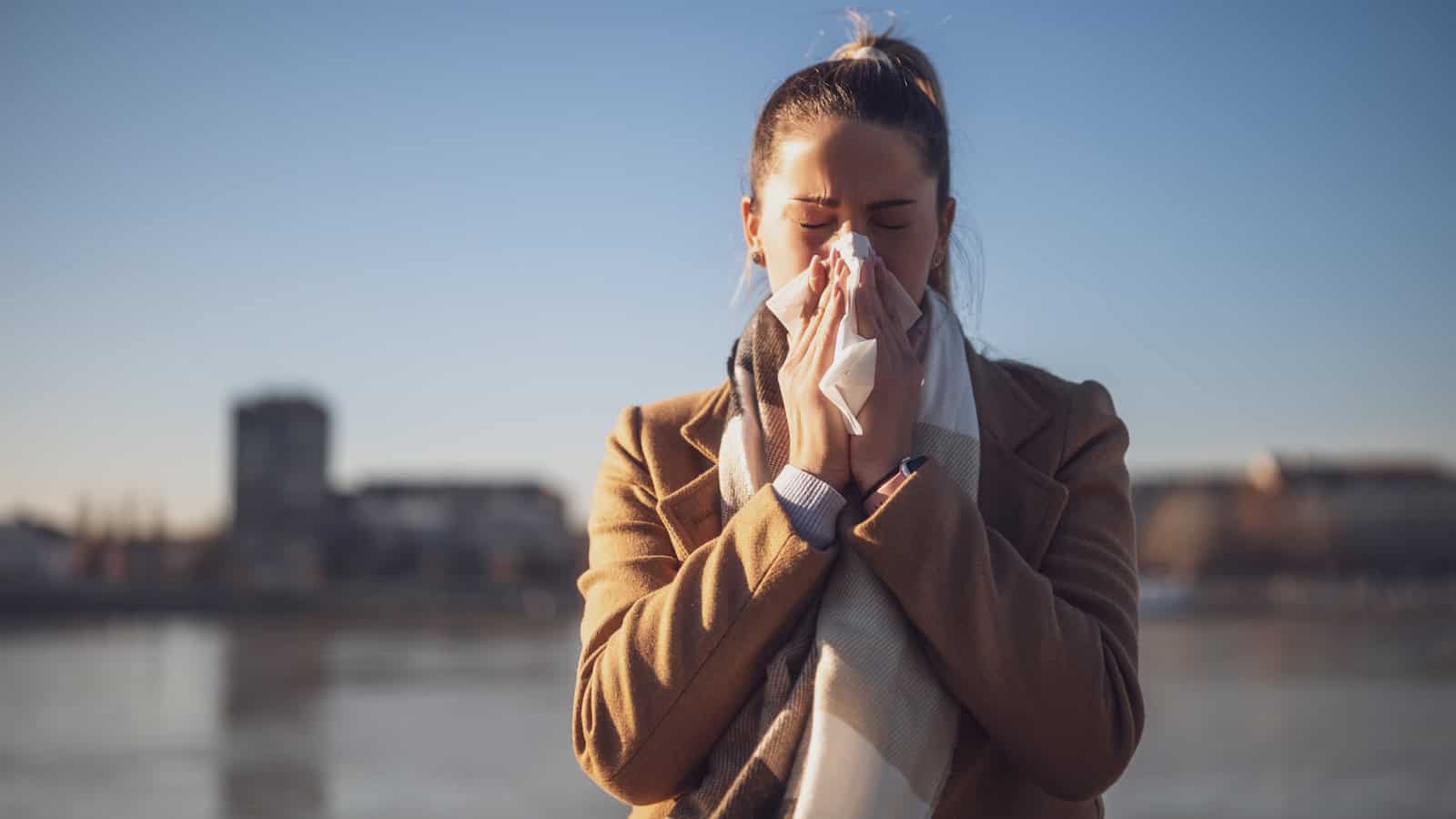 blowing nose cold sick shutterstock_2417311695