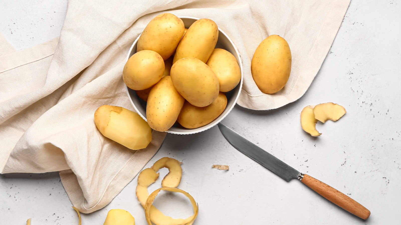 cooking potatoes shutterstock_2281323149