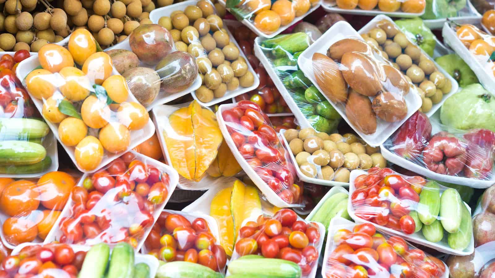 fruits and vegetables in plastic groceries shutterstock_257202382