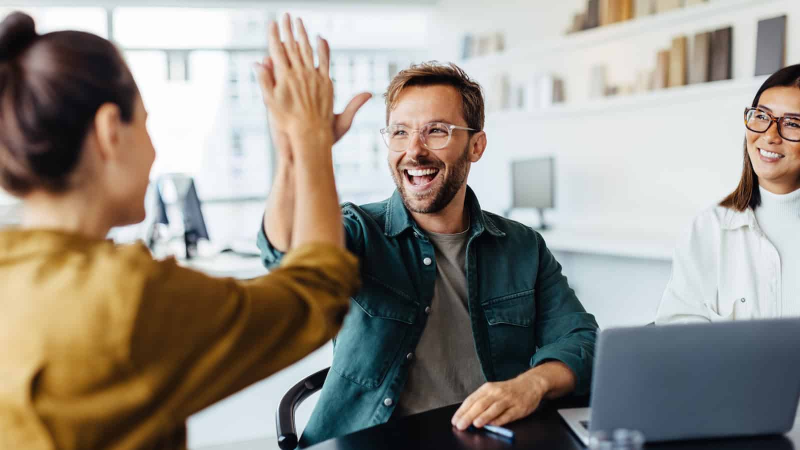 high five happy shutterstock_2237853093