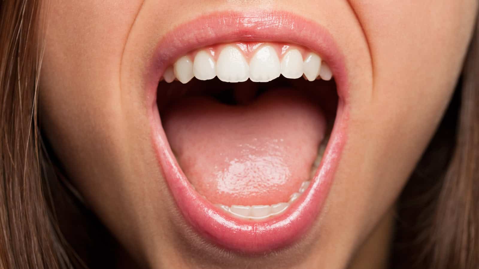 loud laughing teeth tongue mouth shutterstock_171042851