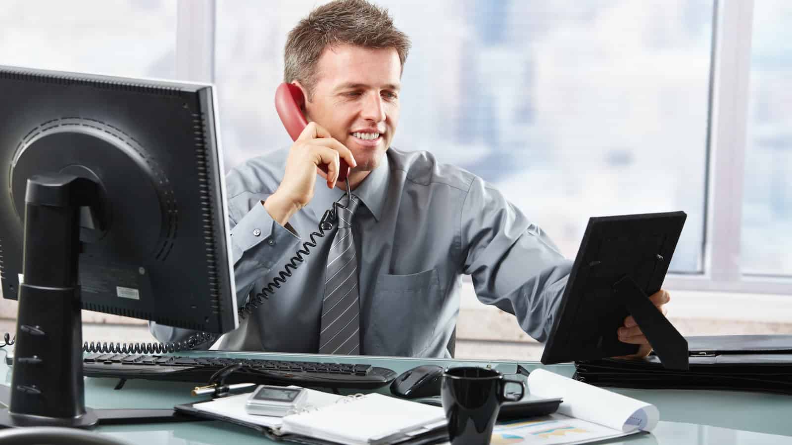 work desk photo on the phone shutterstock_48606997