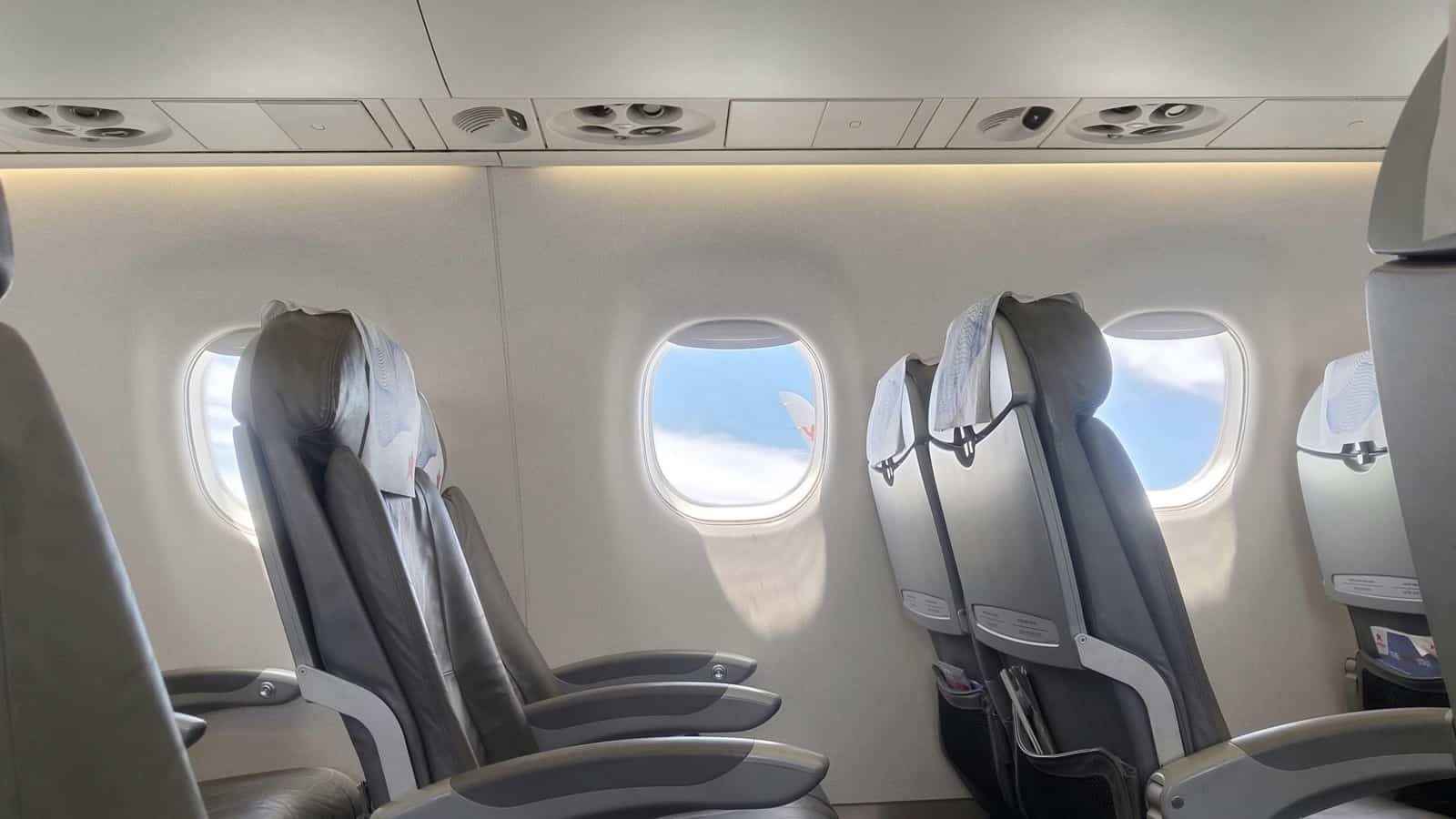 plane flights travel booking lowcost airline sunset flying airport seats armrest