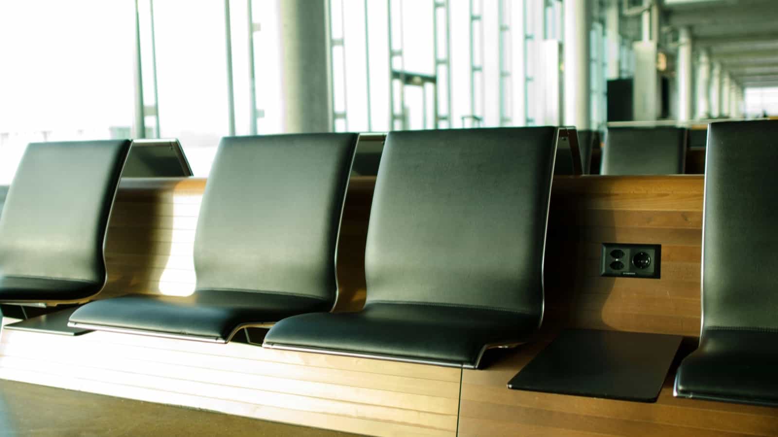airport seats sitting chair lounge waiting room plugs charging