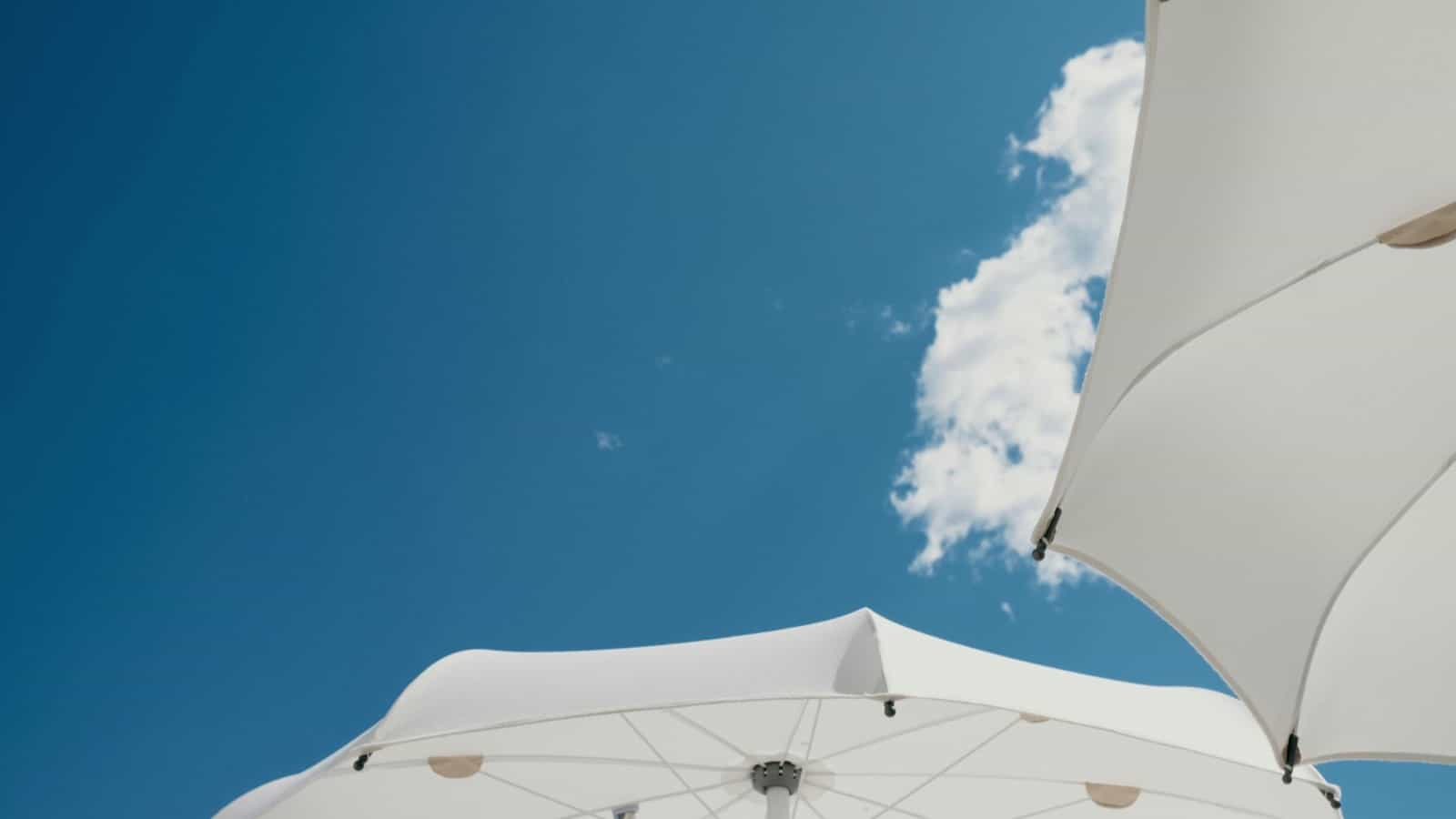 hot weather blue sky umbrella pexels-anete-lusina-16514412resized