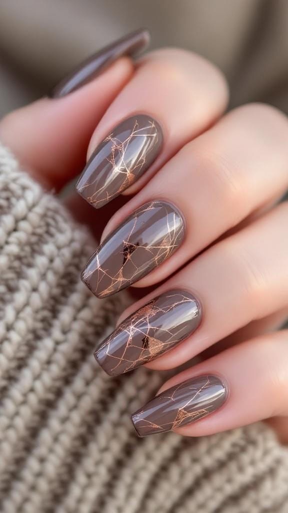 Taupe and rose gold marble nails with intricate designs