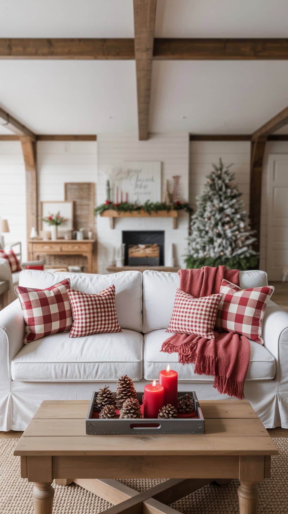 Cozy modern farmhouse living room with buffalo check throw pillows, a soft throw, and festive decor.