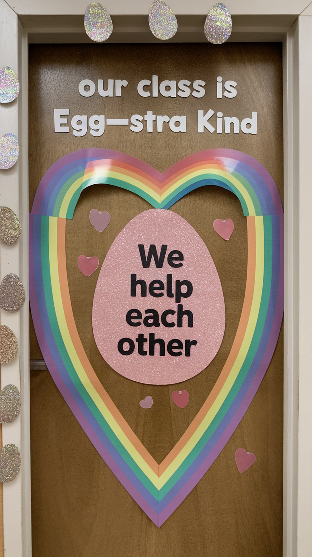Classroom door decorated with colorful eggs and a message about kindness.