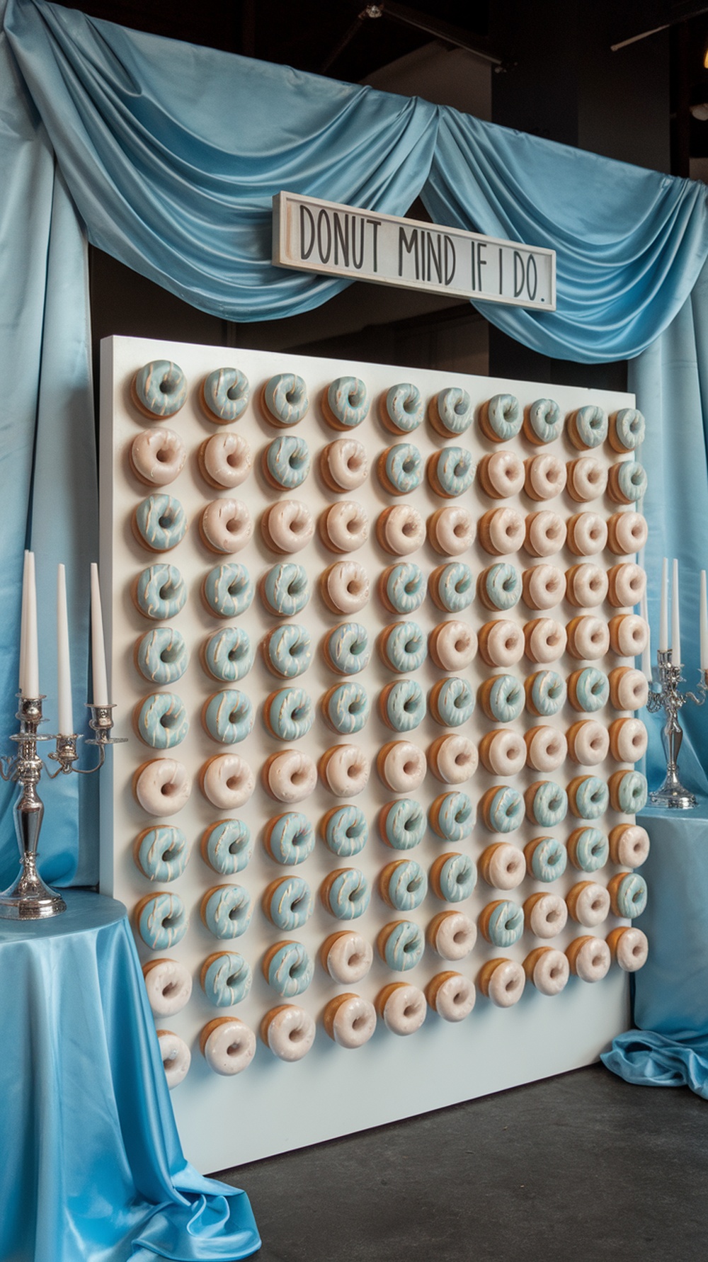 A beautifully arranged donut wall for a bridal shower, featuring blue and neutral-colored donuts with a playful sign.